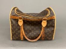 Louis Vuitton dog carrier.