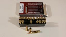 7 rnds 7mm mag & 13 empty brass