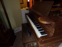 Behning and Sons Baby Grand Piano With Group of Music Books