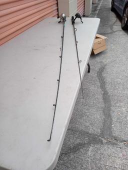 PAIR OF FISHING POLES AND REELS