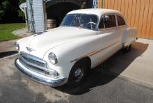 **T** 1951 Chevy Deluxe, 2-door, 6-cylinder, original interior, was painted 4-years ago by car enthu