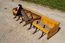 Big Ox 7' 3-Point Box Blade with scarifier teeth, stored inside.