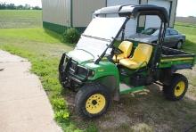 John Deere 620i Gator XUV, 4x4, power dump, shows 702.6 hours