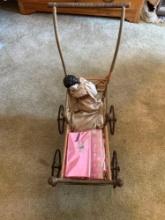 Vintage antique wooden baby doll stroller.with Porcelain head doll.