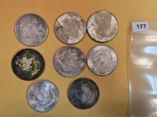 Eight mixed Silver Dollars