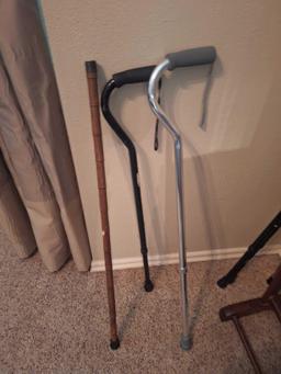 3 walking canes- two with curved handles