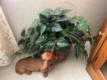 doggie statue and artificial plant