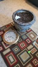 rug, clock and plant pot