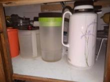 assorted pitchers and items on shelf