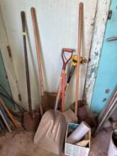 Shovels, sledge hammer and broom