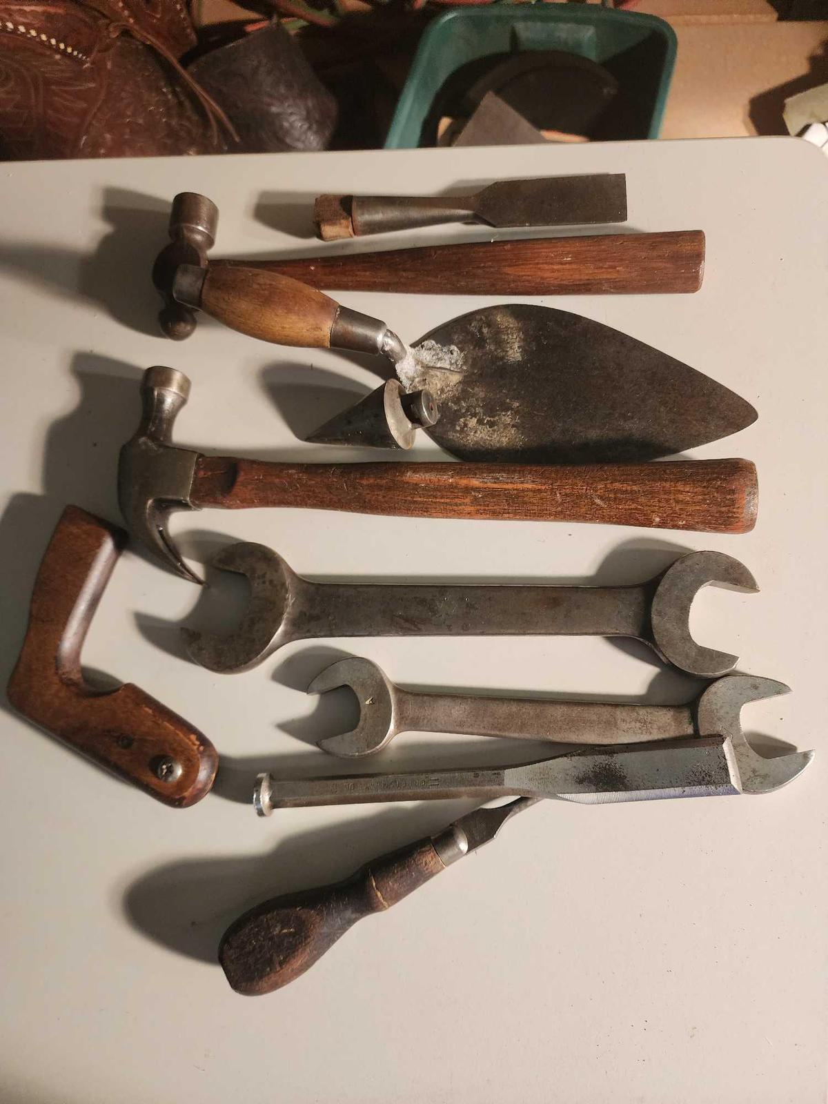 Two hammers, plumb bob, chisels, etc.