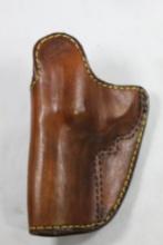 Brown's leather belt clip holster for 3" H&R 32. Used. Right handed inside holster.