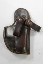 Brown's dark brown leather holster. Used, right handed inside.