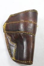 Brown's dark brown leather belt clip holster for 32 H&R. Fits 3" belt. Used, right handed.