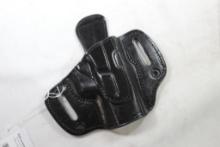 One 1836 TX black leather belt holster for Glock 40. Looks unused, right handed.