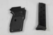 One Bersa 380 magazine and one set of side grips.