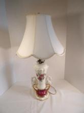 LAMP WITH SWAN AND ROSE DETAIL. LAMP WORKING AT TIME OF TAGGING. POWER CORD TAPED. APPROX 27" H