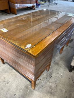 Wooden office desk with glass top