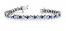 14KT WHITE GOLD 4 CTW G-H VS2/SI1 CLASSIC ROUND BEZEL SET DIAMOND & TANZANITE TENNIS BRACELET