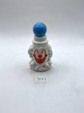 circus clown with liquid avon bottle