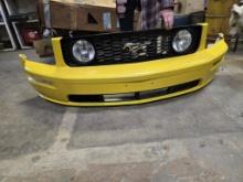 Yellow Ford mustang front bumper assembly