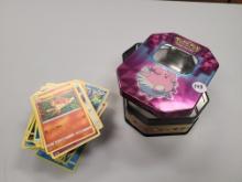 Pokemon tin with trading cards