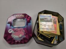 Pokemon tin with trading cards