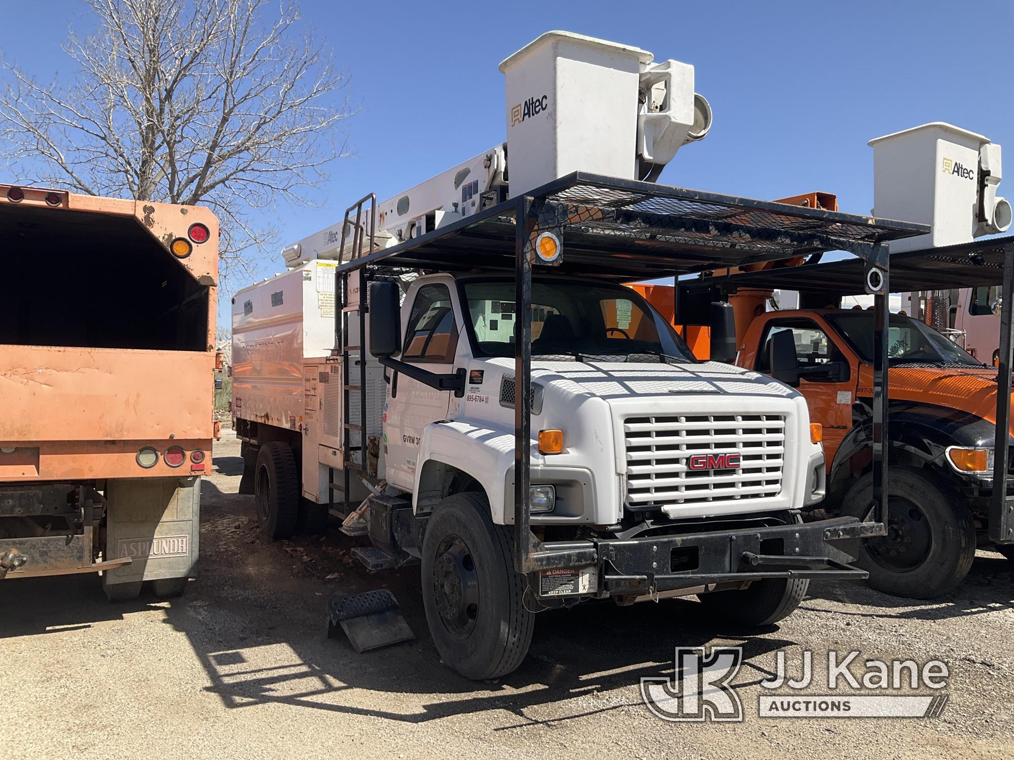 (Kansas City, MO) Altec LRV55, Over-Center Bucket Truck mounted behind cab on 2006 GMC C7500 Chipper