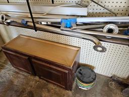 Shelf unit with contents including pipe clamps