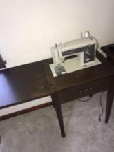 Sears Kenmore sewing machine with cabinet -upstairs