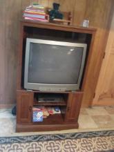 ENTERTAINMENT CENTER W/ BOOKS AND TV