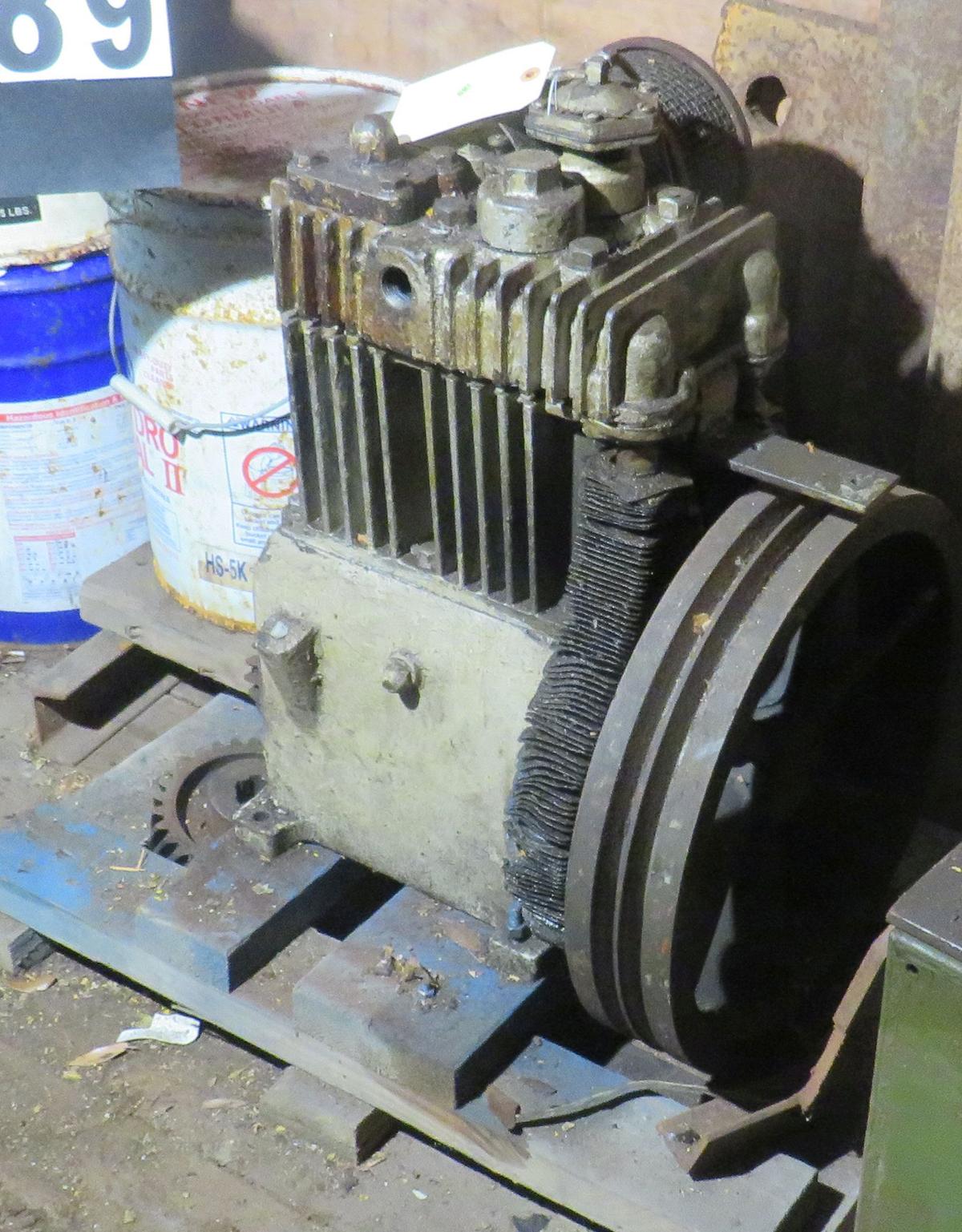 large 2 cylinder cast block air compressor (no motor or tank) probably 25 hp.