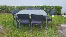 BRAND NEW SYNTHETIC WICKER AND LUMINUM FRAMING TABLE 59" BY 59" WITH 8 ALUMINUM GREY STACKING CHAIR