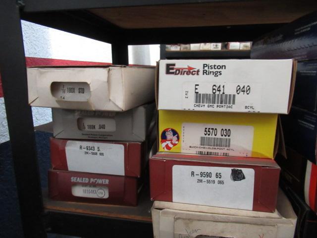 CONTENTS OF SHELF - ASSORTED PISTON RINGS & OIL PICKUPS