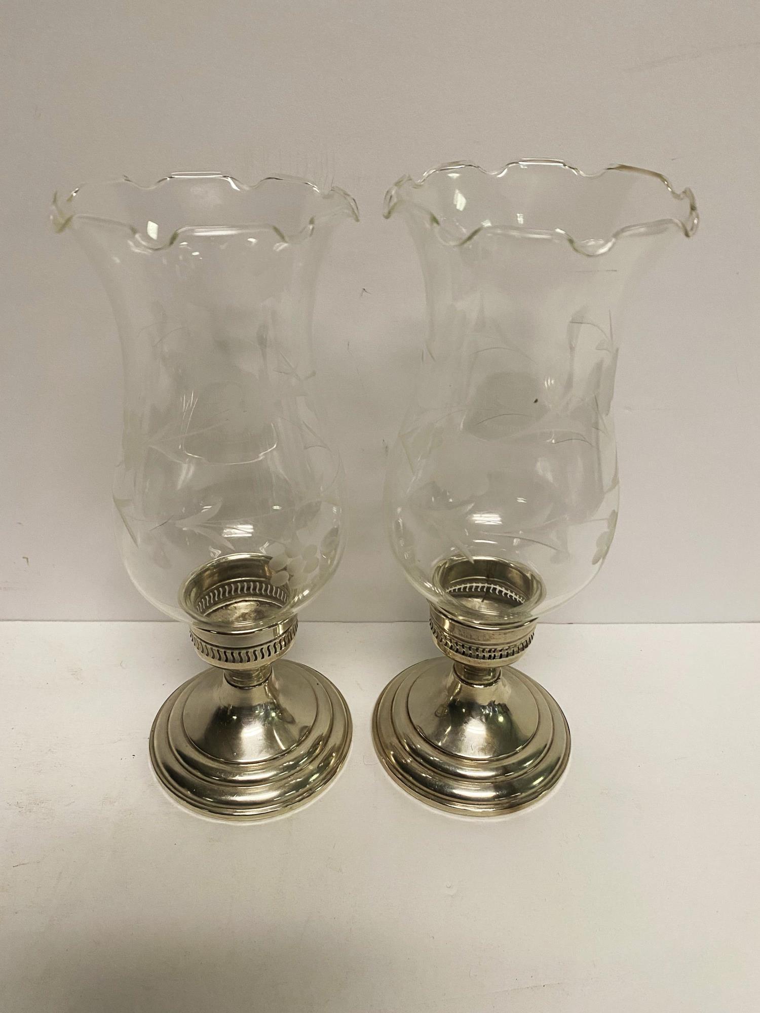 TWO PAIRS OF STERLING SILVER CANDLESTICKS
