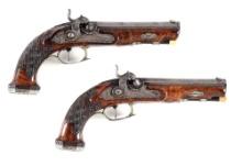 (A) A PAIR OF SILVER MOUNTED PERCUSSION PISTOLS SIGNED KREISSER / LIEPZIG.