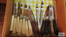 Assorted steak knives and other knives