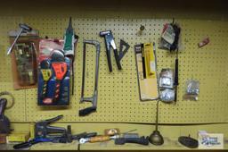 tools, hardware and etc on pegboard