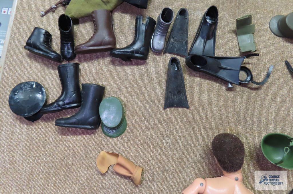 Two vintage GI Joe action figures from 1964 with accessories. one figure is missing a hand.