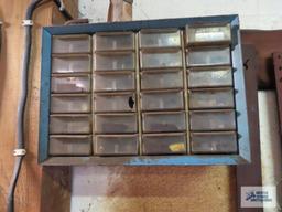 Hardware cabinet with assorted hardware. Bring tools for removal