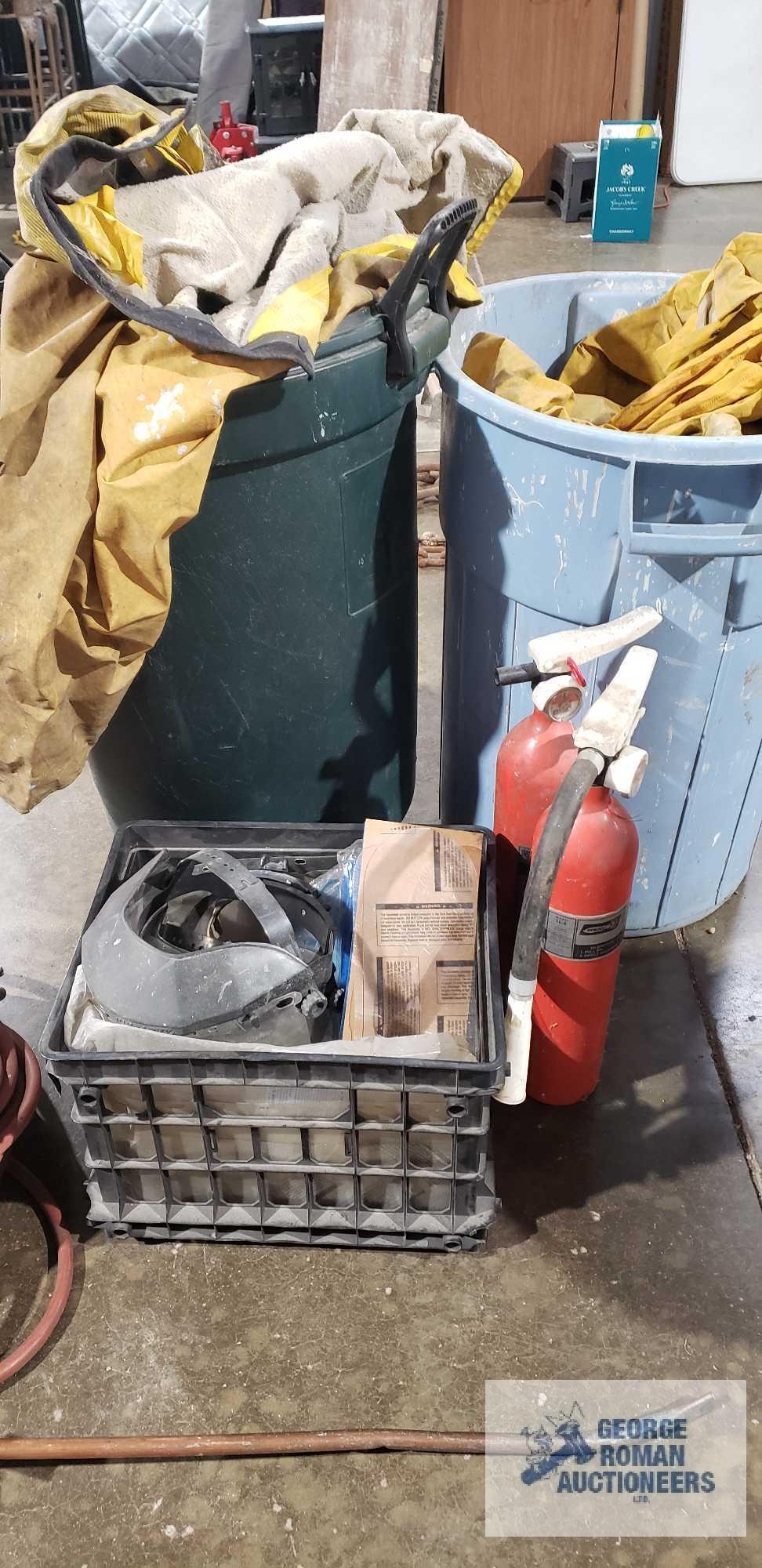 Lot of rain gear, safety shield masks and fire extinguishers