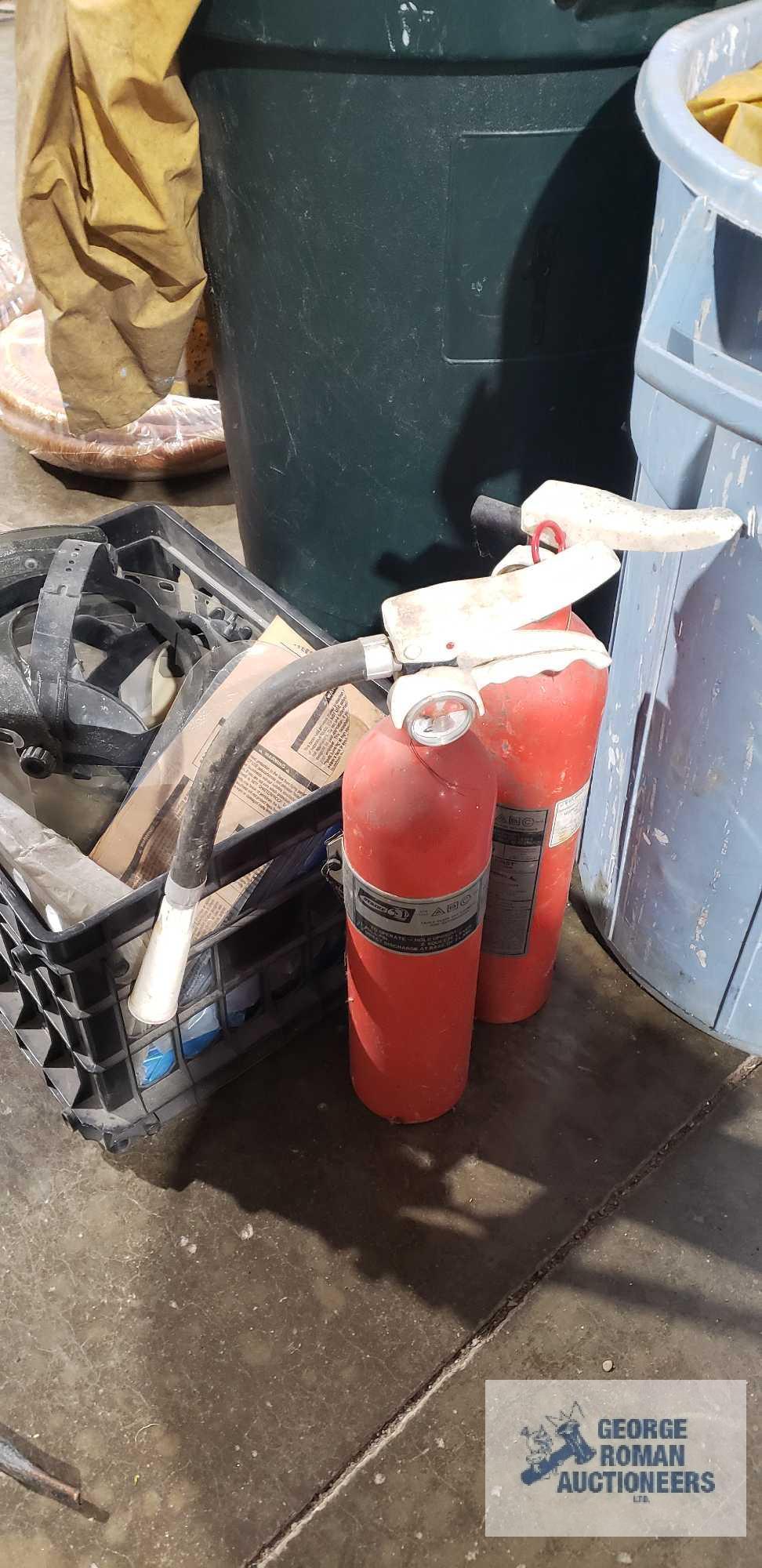 Lot of rain gear, safety shield masks and fire extinguishers
