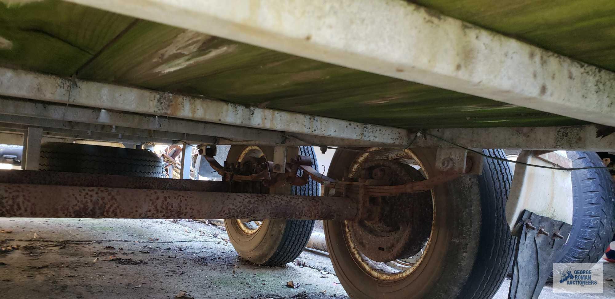 Galvanized shopmade utility trailer with dual 3500 lb axles, measures 14 ft by 5 ft 11 in. It takes