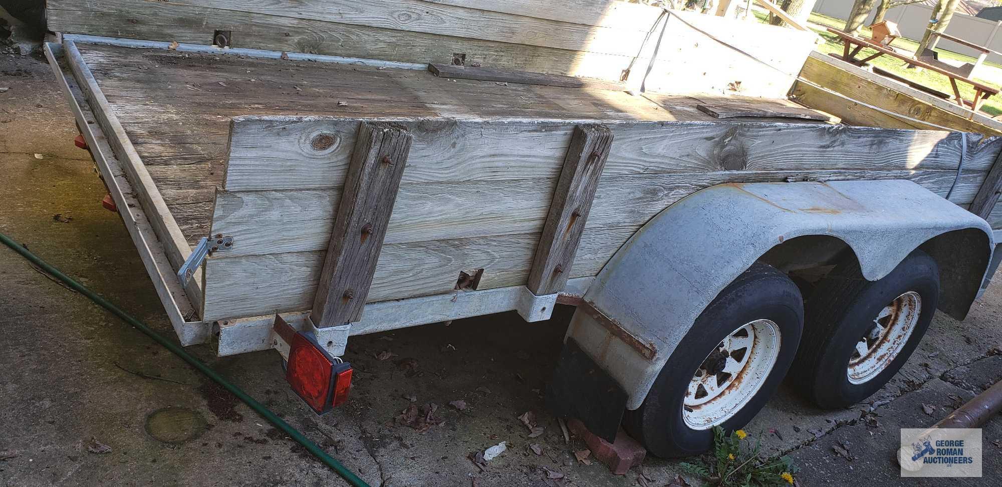 Galvanized shopmade utility trailer with dual 3500 lb axles, measures 14 ft by 5 ft 11 in. It takes