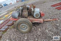 Heavy duty gas air compressor mounted on heavy duty trailer. Kohler engine