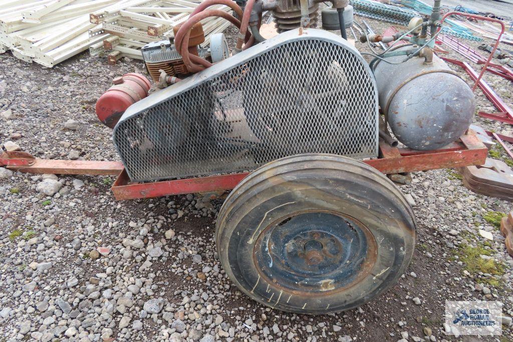 Heavy duty gas air compressor mounted on heavy duty trailer. Kohler engine