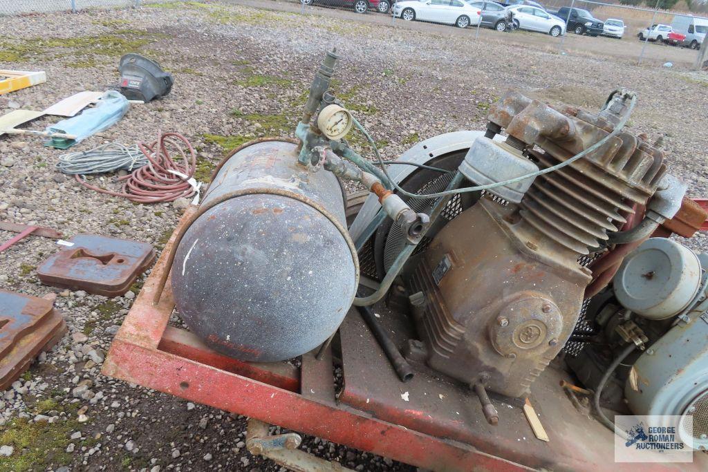 Heavy duty gas air compressor mounted on heavy duty trailer. Kohler engine