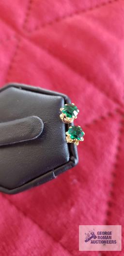 Green gemstone earrings, marked 14K,...backs are also marked 14K, total approximate weight is .45 G