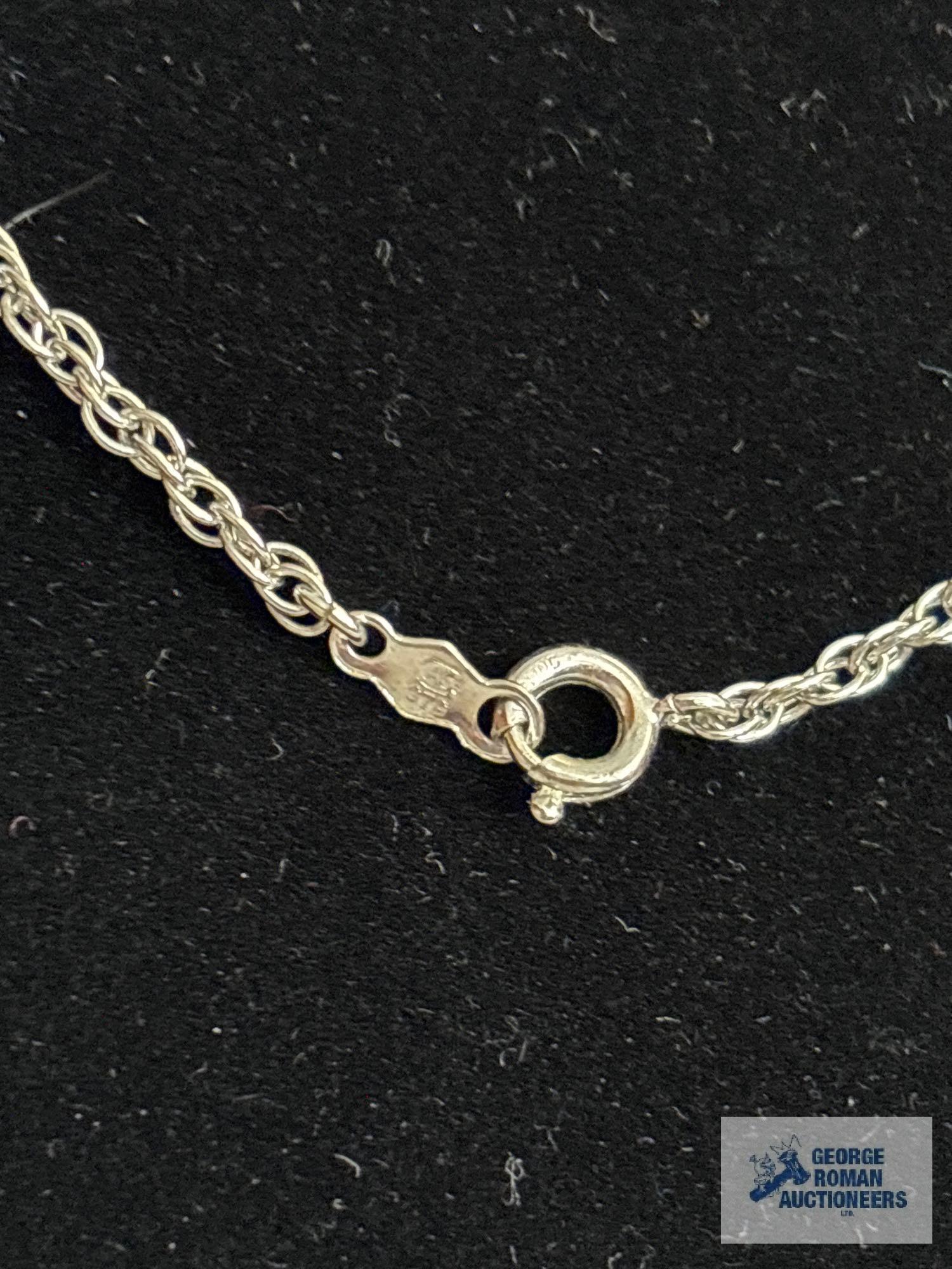 Silver colored rope chain, marked STG, approximate total weight is 4.47 G