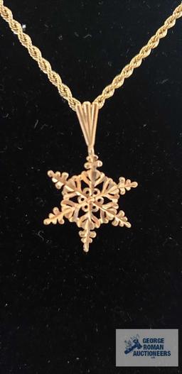 Gold colored snowflake pendant, marked 14K on gold colored rope necklace, marked 14KT Italy,